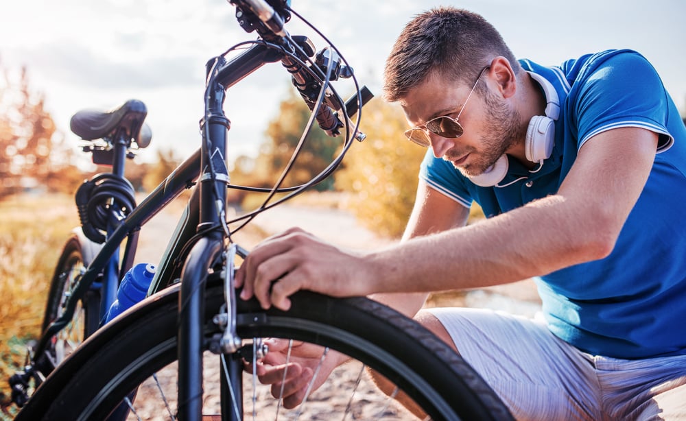 inspecting bike